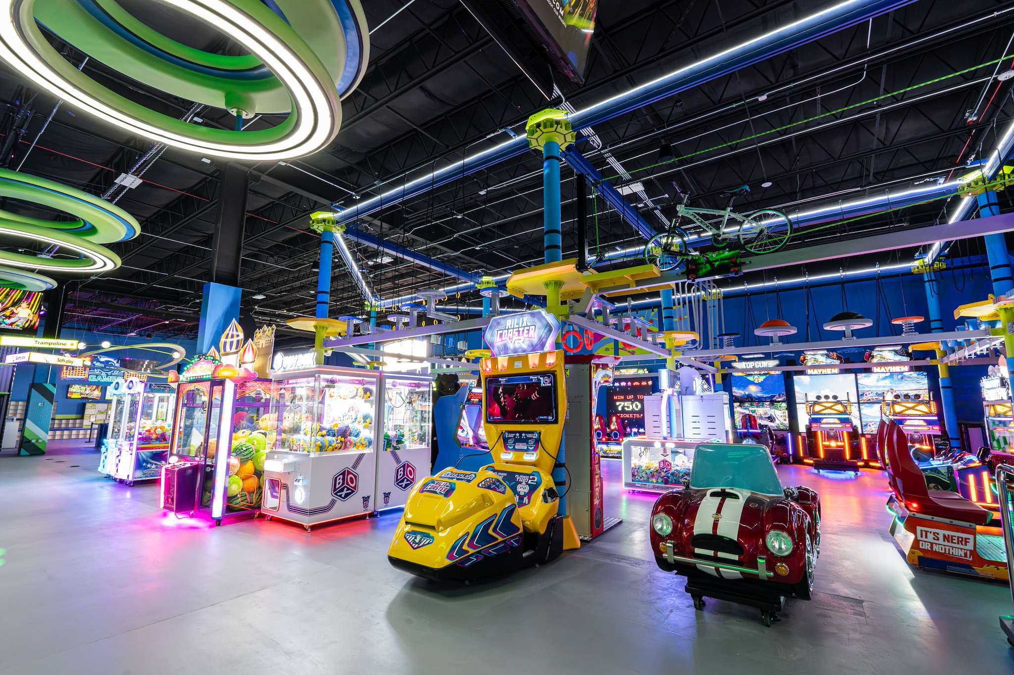 Arcade games and kiddie car rides at NRG Fargo